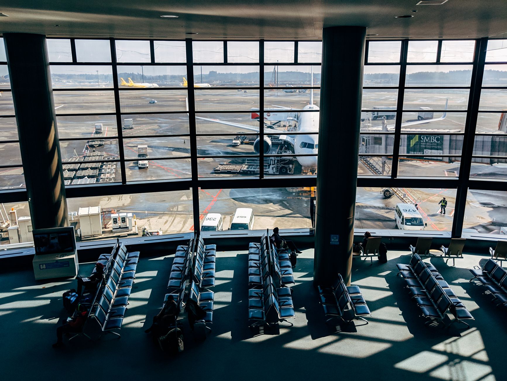Airport terminal with tarmac view — Star Alliance Gold status unlocks lounge access at partner airports globally